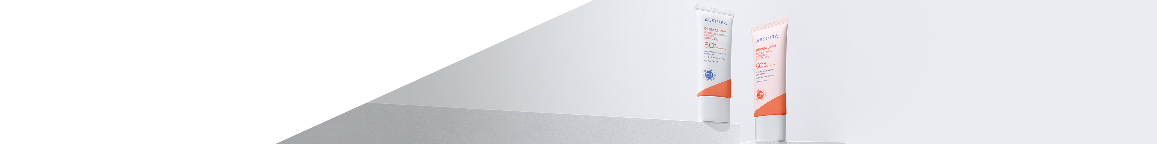 Aestura DERMAUV365 sunscreens with SPF 50+ standing on minimalistic white platforms against a soft gray background.